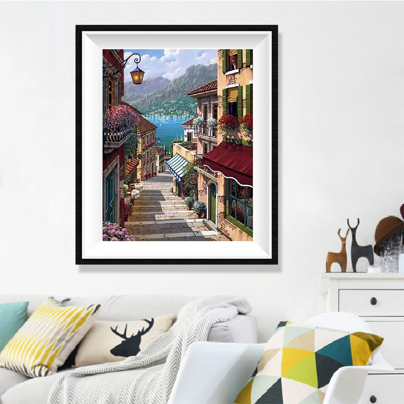 Italian Lake Town Stairway Diamond Painting Kit – Cobblestone Steps to Blue Lake with Flower Balconies & Café Awnings JX80